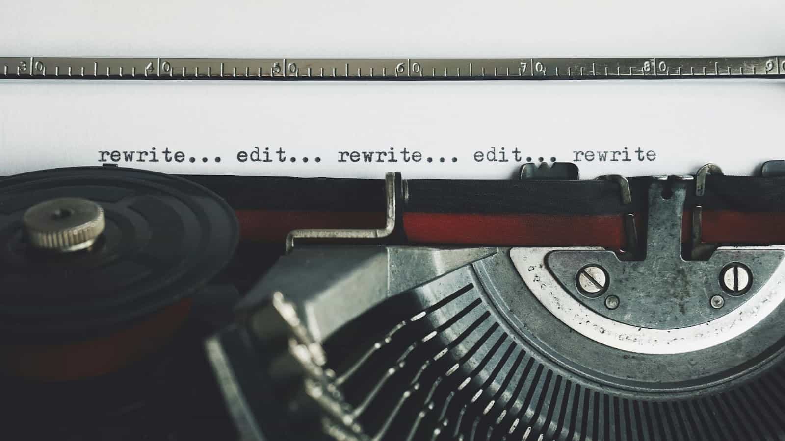 Close-up of a typewriter with text: rewrite... edit...