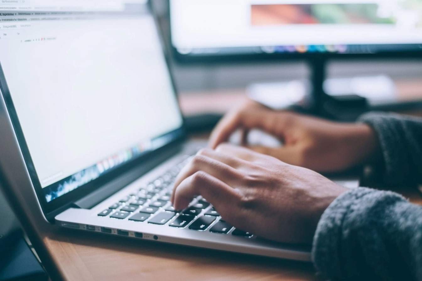 Person typing on a laptop