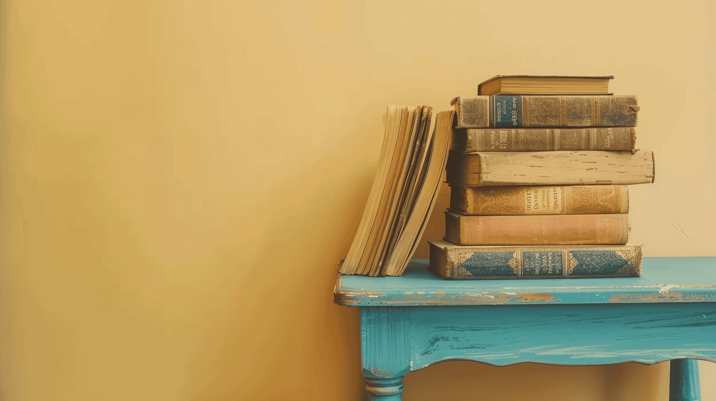 Pile of old books on a blue table